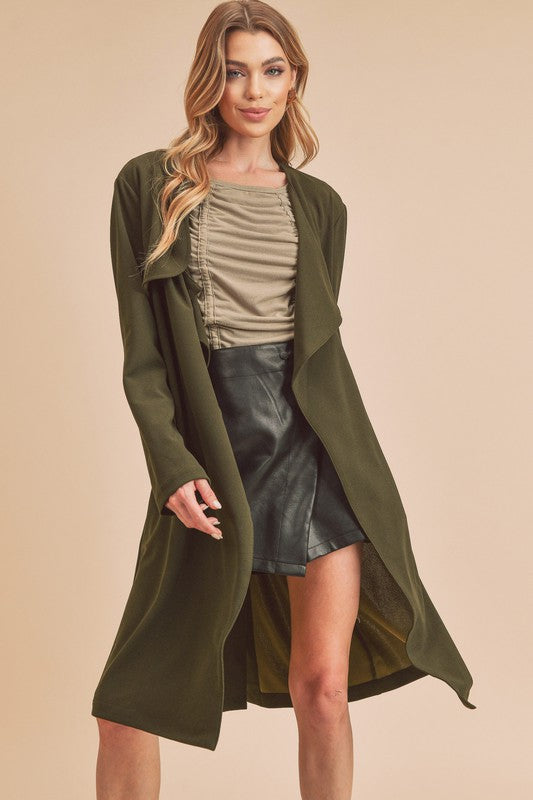 Chic open-front longline coat with long sleeves and pockets, perfect for layering.