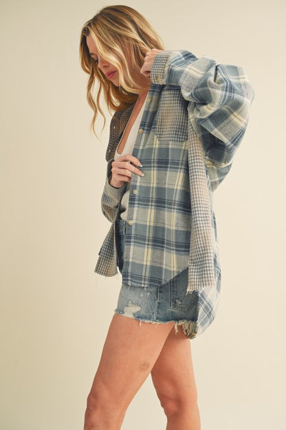 Classic plaid button-down flannel shirt with a cozy fit, perfect for layering in cooler weather.