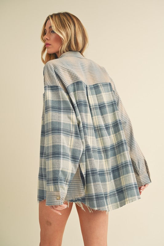 Classic plaid button-down flannel shirt with a cozy fit, perfect for layering in cooler weather.