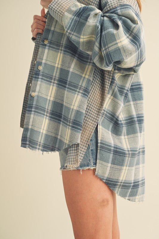 Classic plaid button-down flannel shirt with a cozy fit, perfect for layering in cooler weather.