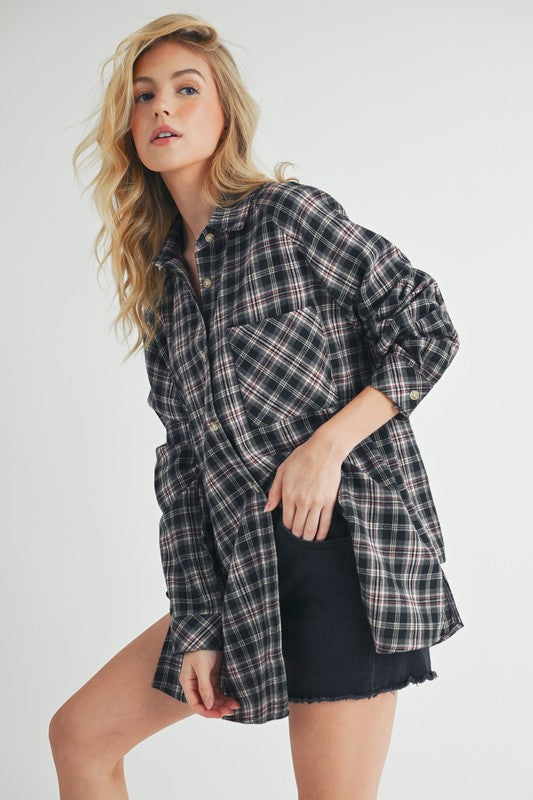 Classic plaid button-up flannel shirt with a chest pocket, perfect for layering and casual styling.