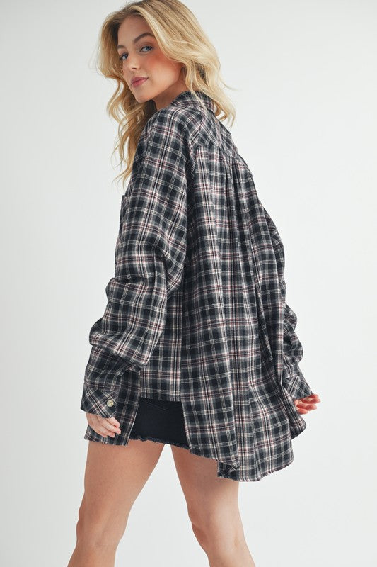 Classic plaid button-up flannel shirt with a chest pocket, perfect for layering and casual styling.