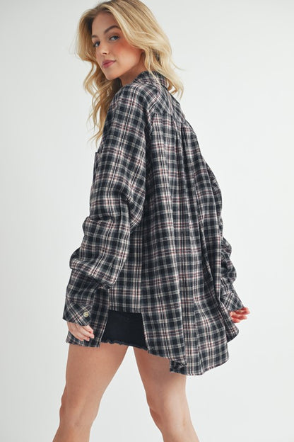 Classic plaid button-up flannel shirt with a chest pocket, perfect for layering and casual styling.