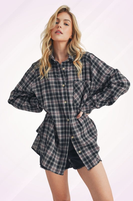 Classic plaid button-up flannel shirt with a chest pocket, perfect for layering and casual styling.