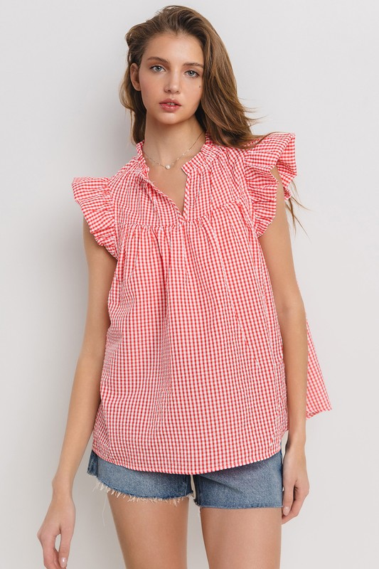 Chic plaid blouse with a flattering notched neckline and ruffled cap sleeves, perfect for a stylish and versatile look.