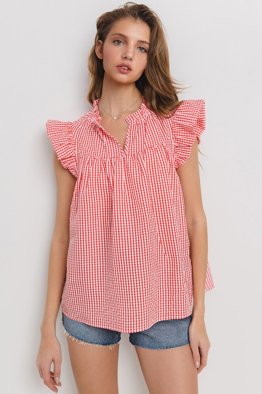 Chic plaid blouse with a flattering notched neckline and ruffled cap sleeves, perfect for a stylish and versatile look.