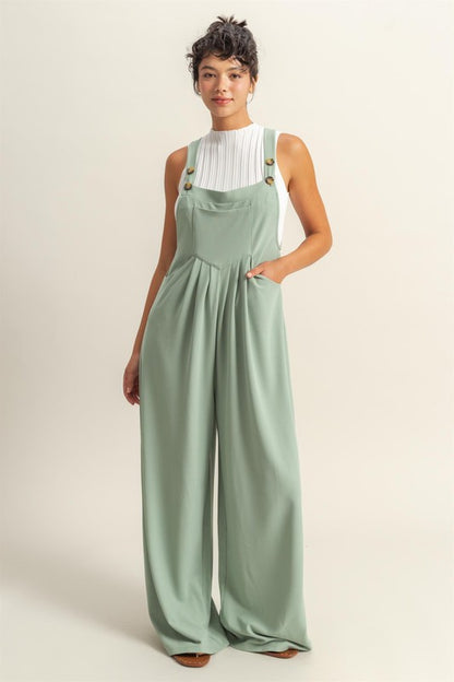 Pleated detail wide strap overalls with front pockets, designed for a stylish and comfortable casual look.