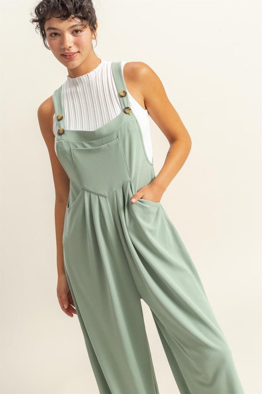 Pleated detail wide strap overalls with front pockets, designed for a stylish and comfortable casual look.