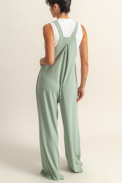 Pleated detail wide strap overalls with front pockets, designed for a stylish and comfortable casual look.