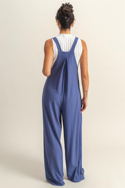 Chic pleated front pocket wide strap overalls with a relaxed and comfortable fit, perfect for casual styling.