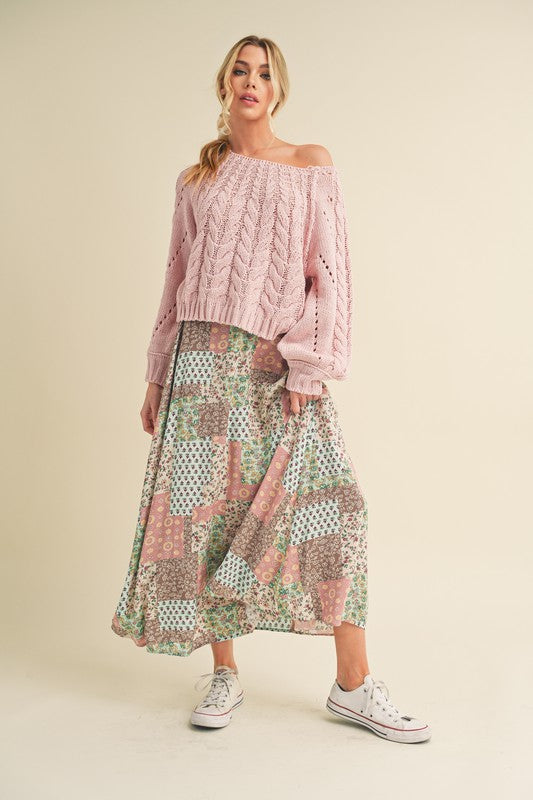 Flowy printed maxi skirt with a vibrant design, perfect for elegant and casual looks.