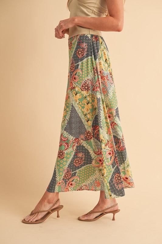 Flowy printed maxi skirt with a bold pattern, perfect for casual or dressy outfits.