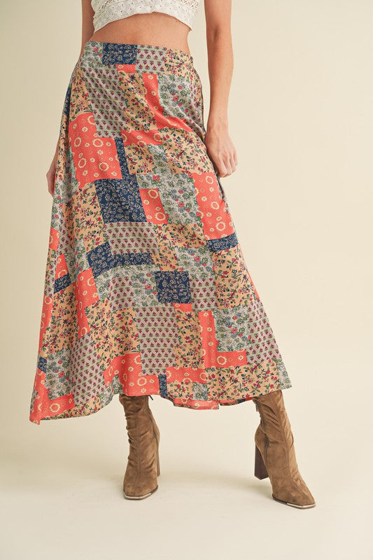 Flowy printed maxi skirt with bold patterns, perfect for an elegant and stylish look.