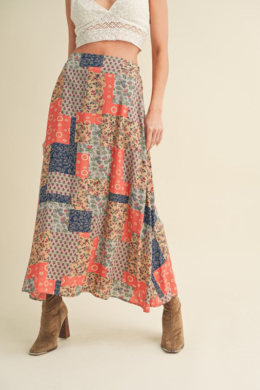 Flowy printed maxi skirt with bold patterns, perfect for an elegant and stylish look.