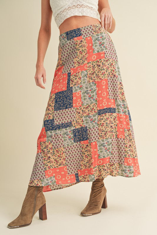 Flowy printed maxi skirt with bold patterns, perfect for an elegant and stylish look.