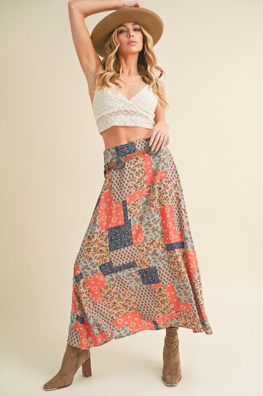 Flowy printed maxi skirt with bold patterns, perfect for an elegant and stylish look.