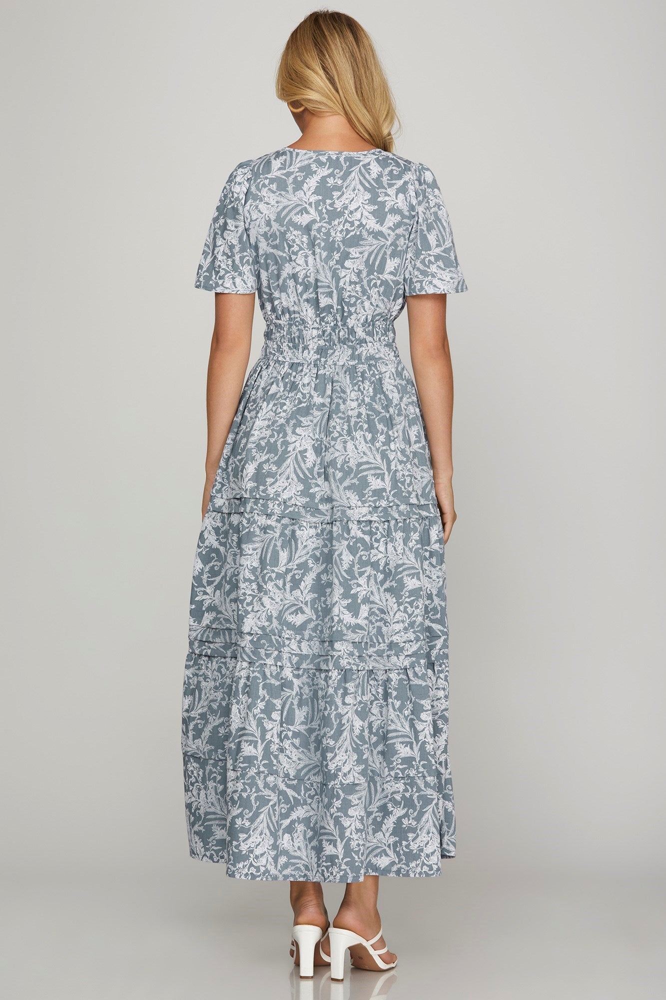 Flowy printed notched woven tiered pintuck maxi dress with a flattering silhouette and side pockets.