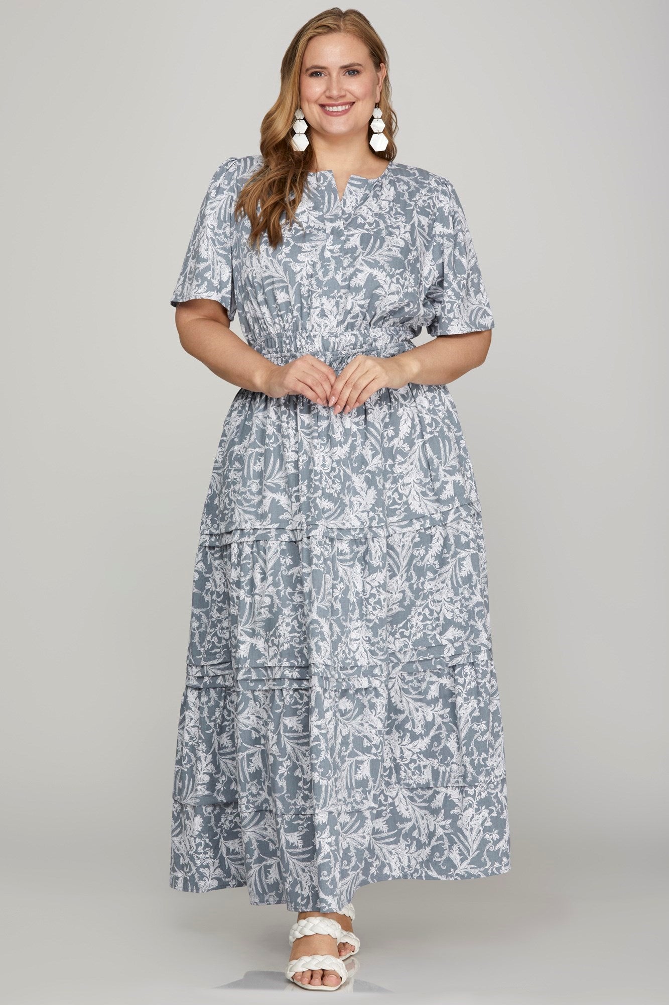 Flowy printed notched woven tiered pintuck maxi dress with a flattering silhouette and side pockets.