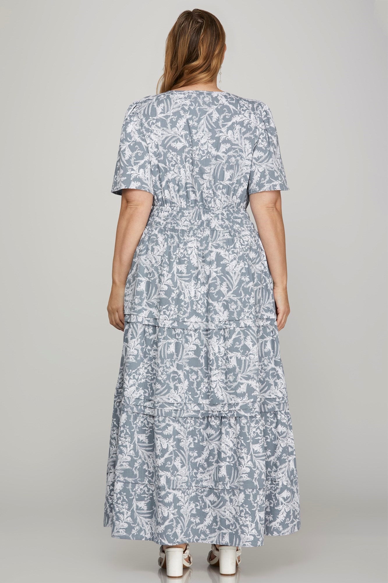 Flowy printed notched woven tiered pintuck maxi dress with a flattering silhouette and side pockets.