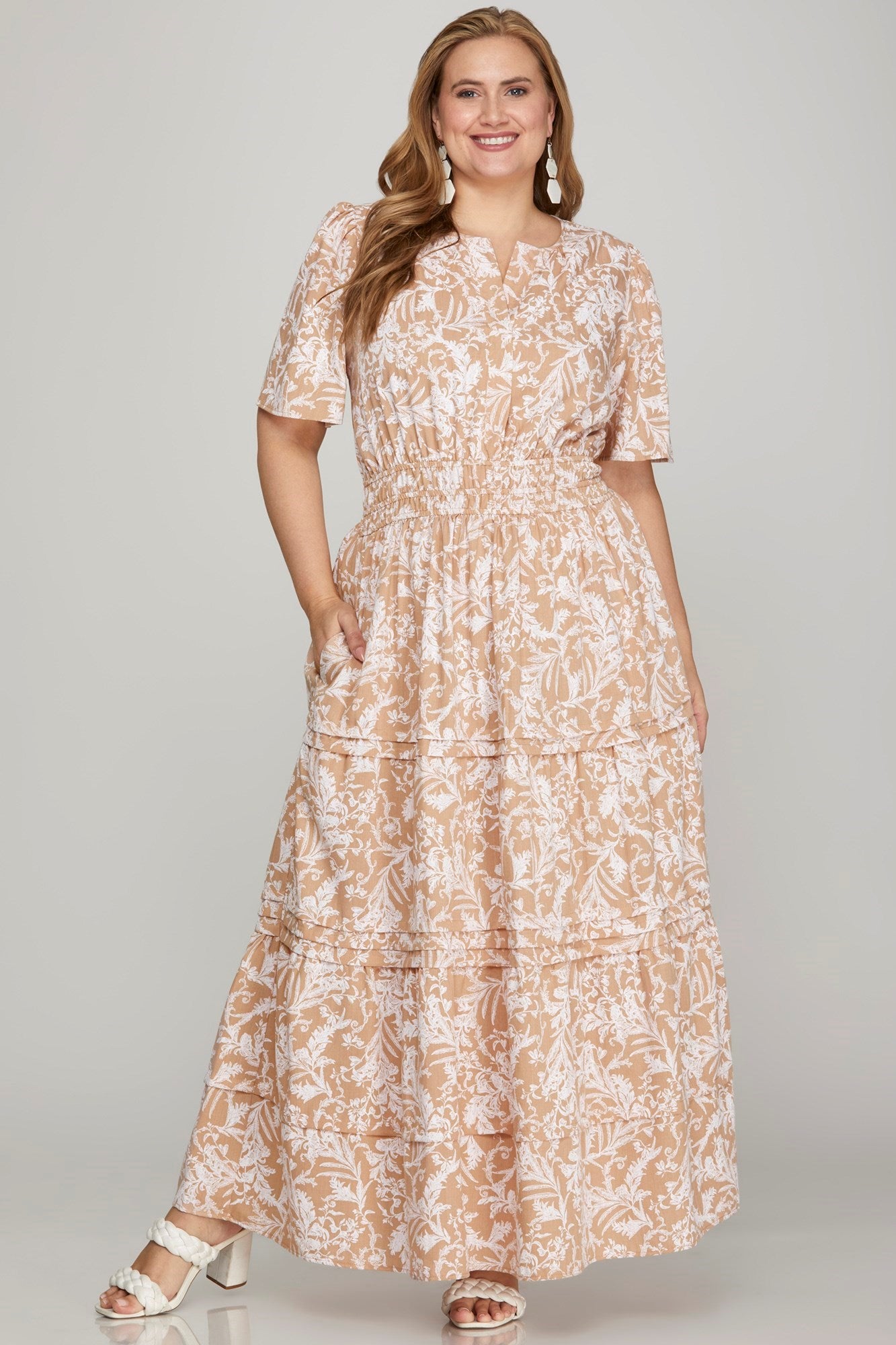 Printed notched woven tiered pintuck maxi dress with a chic design and side pockets for a stylish yet comfortable look.