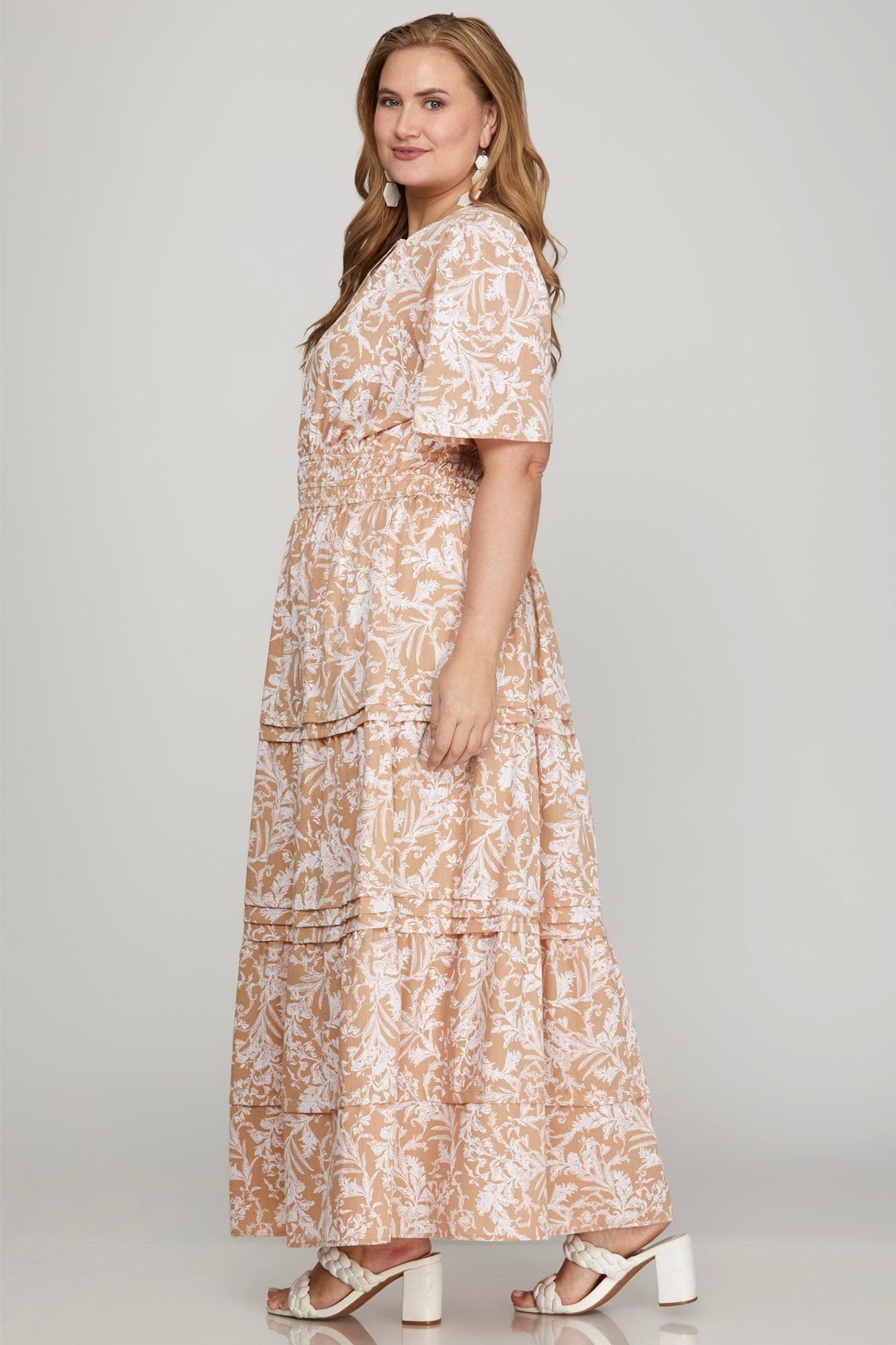 Printed notched woven tiered pintuck maxi dress with a chic design and side pockets for a stylish yet comfortable look.