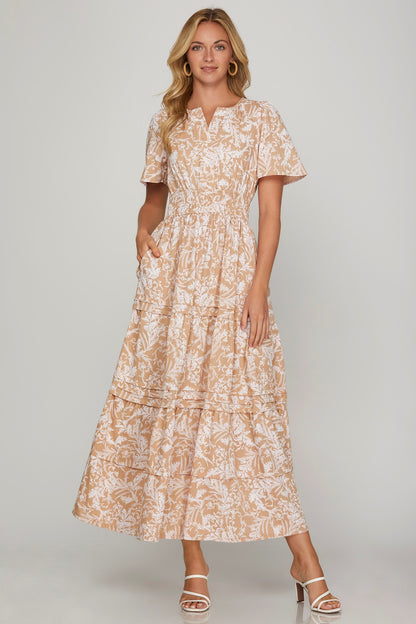 Printed notched woven tiered pintuck maxi dress with a chic design and side pockets for a stylish yet comfortable look.