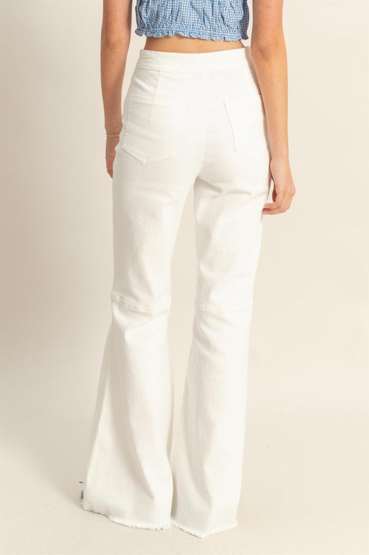 High-waist washed flared jeans with a raw hem for a trendy vintage-inspired style.