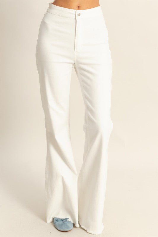 High-waist washed flared jeans with a raw hem for a trendy vintage-inspired style.