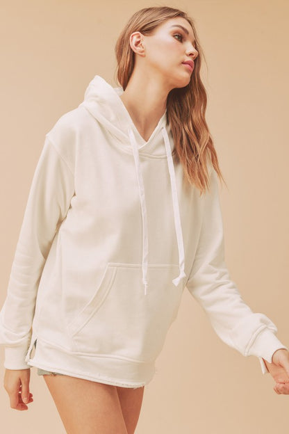 Stylish raw hem hoodie with a drawstring hood and kangaroo pocket, perfect for casual and trendy wear.