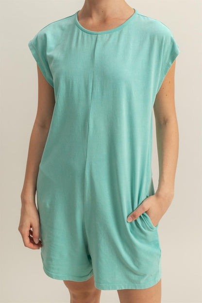 Casual and breezy romper with a round neck, cap sleeves, and a relaxed fit, perfect for summer wear.