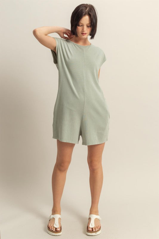 Casual round neck cap sleeve breezy romper with pockets, perfect for warm-weather comfort and effortless style.