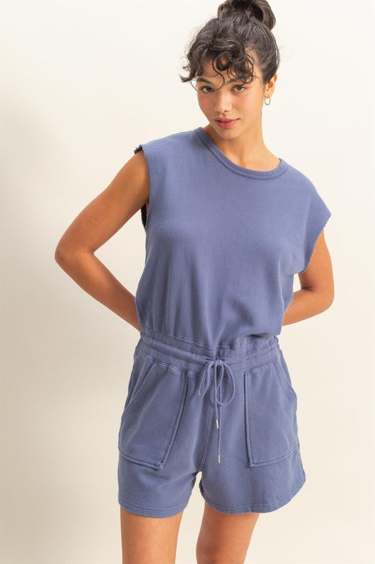 Casual round neck cap sleeve drawstring waist romper with pockets for effortless style and comfort.