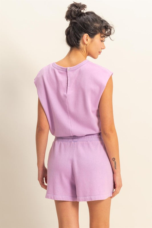 Chic round neck cap sleeve romper with drawstring waist, perfect for casual & laid-back occasions.