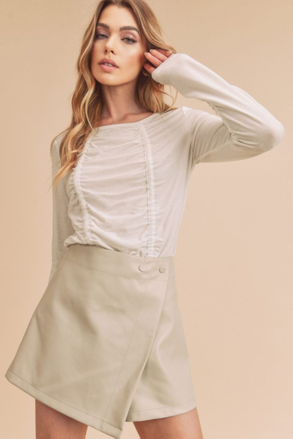 Flattering ruched front round neck long sleeve t-shirt in soft fabric, offering a stylish and comfortable fit for everyday wear.