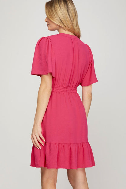 Chic ruffled hem mini dress with notched flutter sleeves, designed for a feminine & playful look.