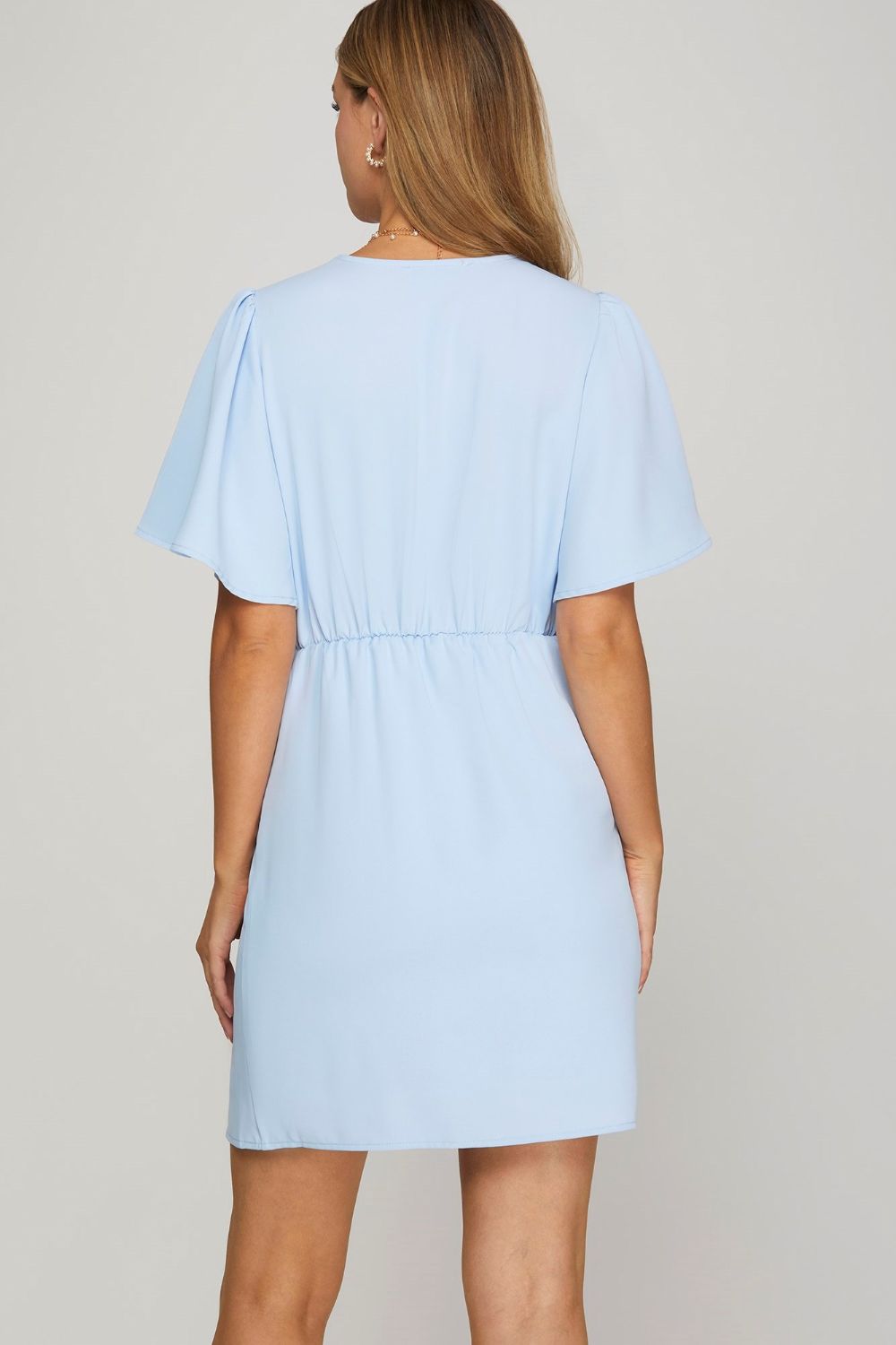 Ruffled surplice short flutter sleeve mini dress in a chic and feminine design, perfect for any occasion.