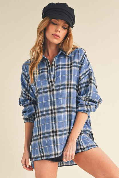 Classic plaid long sleeve polo shirt with side slits and high-low hem for a modern touch.