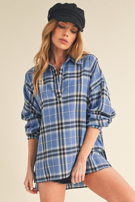 Classic plaid long sleeve polo shirt with side slits and high-low hem for a modern touch.