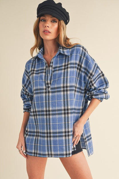 Classic plaid long sleeve polo shirt with side slits and high-low hem for a modern touch.