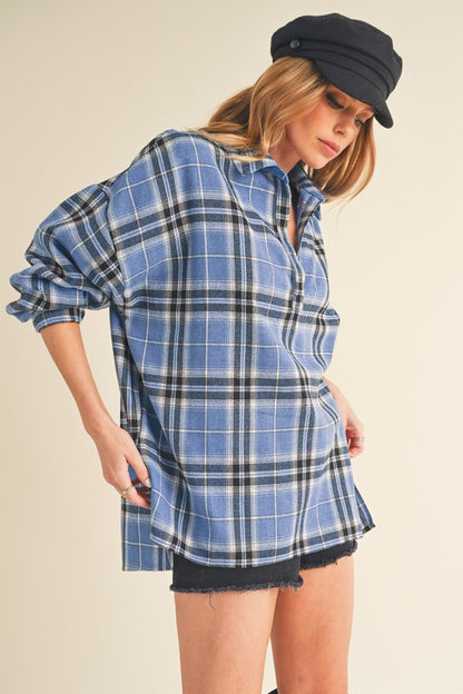 Classic plaid long sleeve polo shirt with side slits and high-low hem for a modern touch.