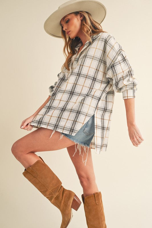 Trendy high-low plaid long sleeve polo shirt with side slits for a modern and stylish look.