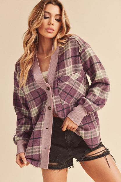 Cozy plaid button-down jacket with side slits and patch pockets for a stylish layered look.