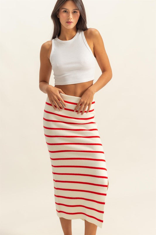 Side slit striped bodycon sweater skirt with a snug fit, cozy knit fabric, and elegant slit detail for a stylish winter look.