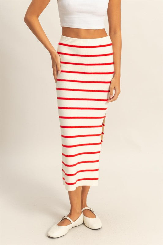 Side slit striped bodycon sweater skirt with a snug fit, cozy knit fabric, and elegant slit detail for a stylish winter look.