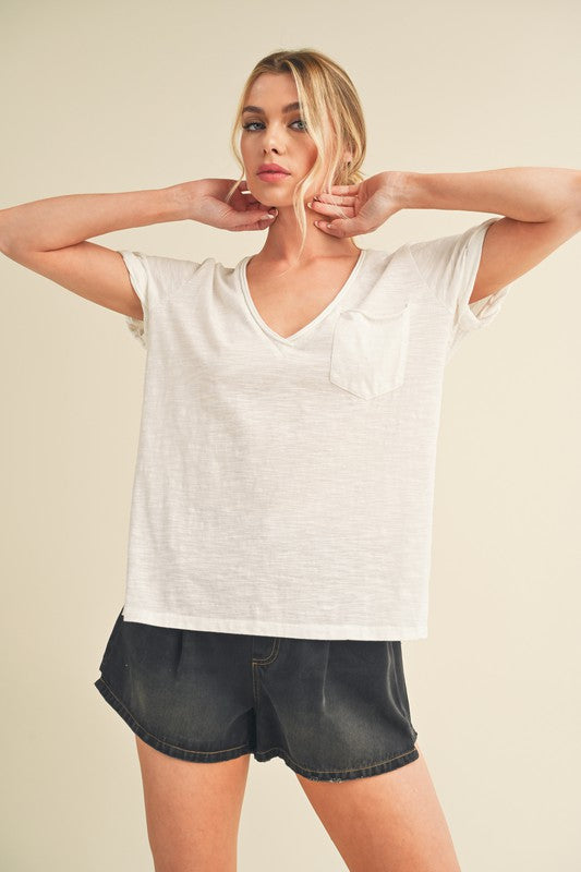 Side slit V-neck short rolled sleeve t-shirt with a relaxed and stylish fit for casual wear.