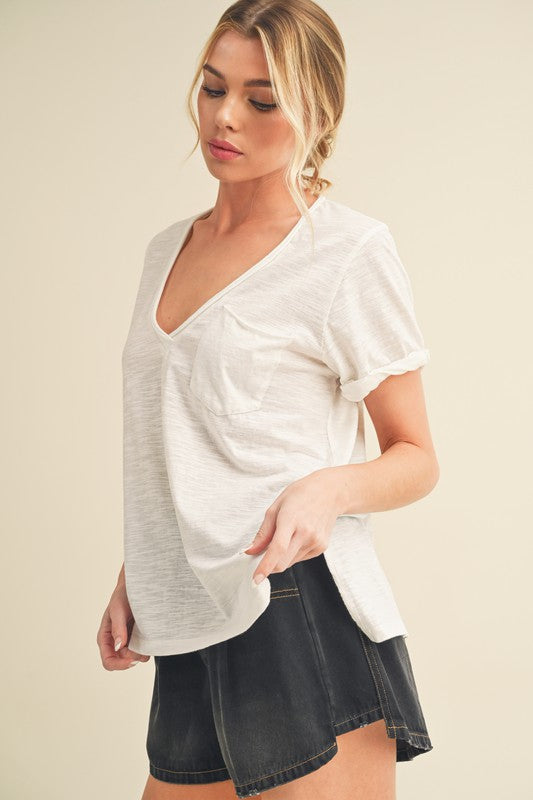 Side slit V-neck short rolled sleeve t-shirt with a relaxed and stylish fit for casual wear.