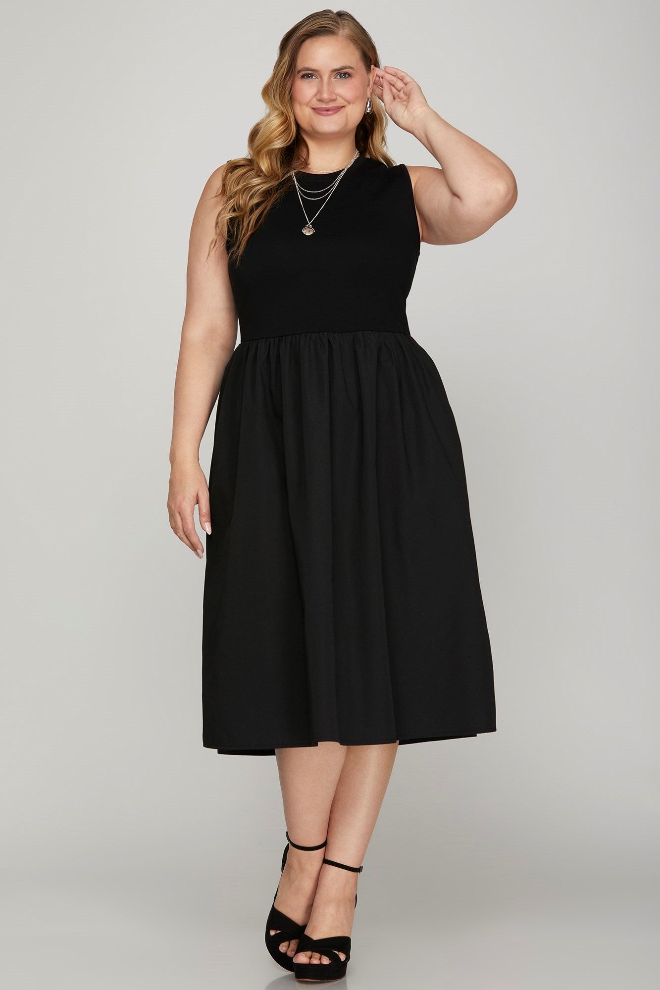 Full-size sleeveless poplin woven midi dress with pockets, featuring a flattering and breathable design for versatile styling.