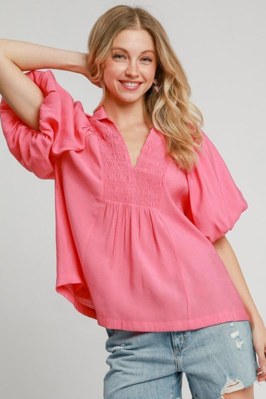 Puff sleeve blouse with smocked bodice, offering a flattering fit and soft silhouette for stylish plus-size wear.