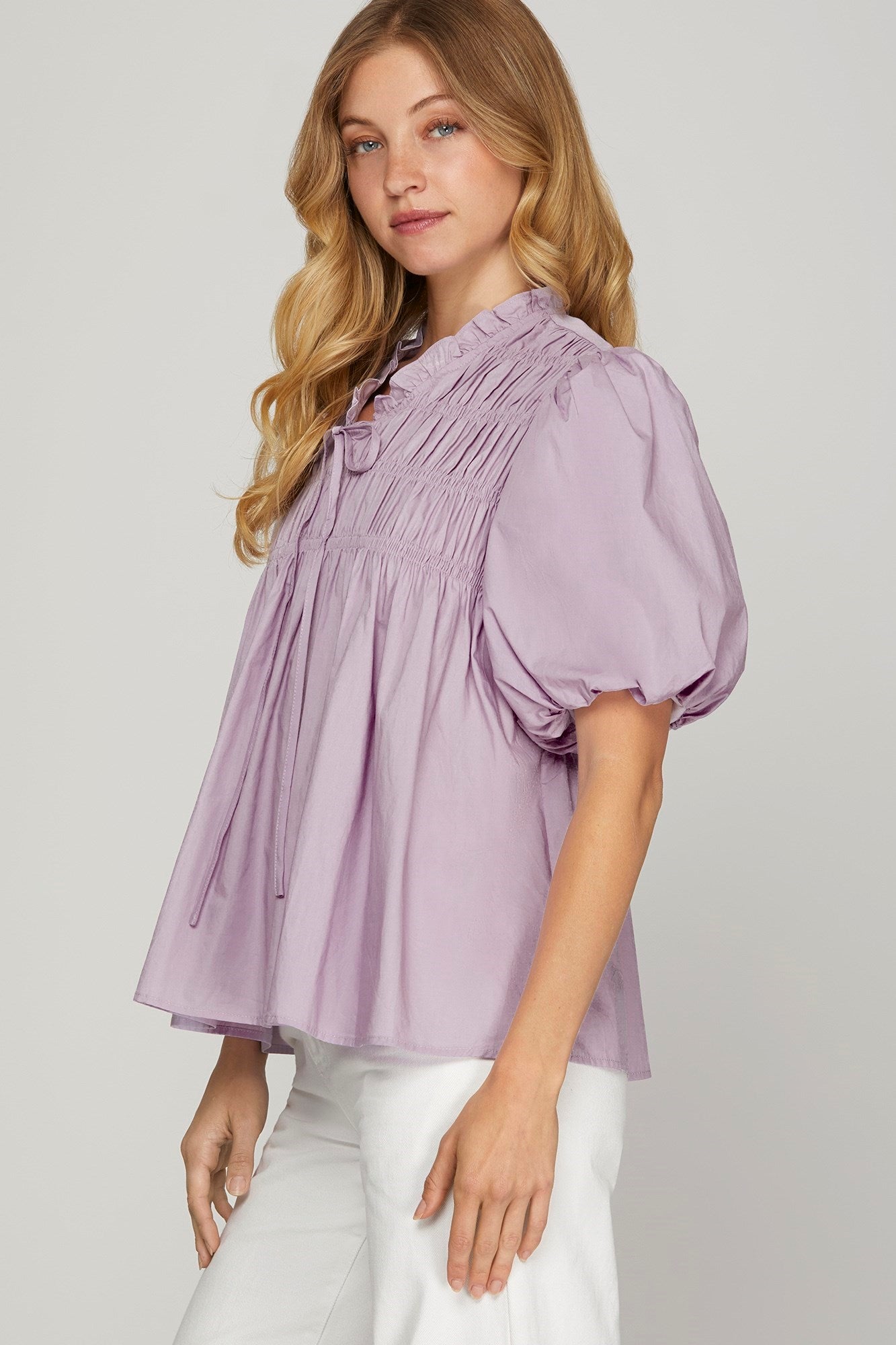 Trendy woven blouse with a smocked front, puff sleeves, and a chic, polished look for effortless elegance.