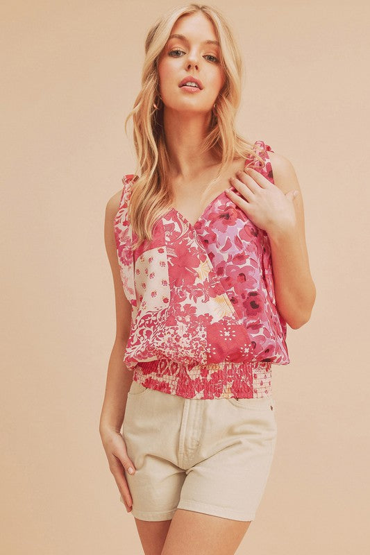 Chic printed surplice tank with a smocked hem, perfect for stylish and flattering summer outfits.